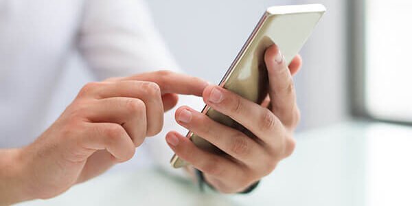 close-up-of-male-hands-using-smartphone (1)